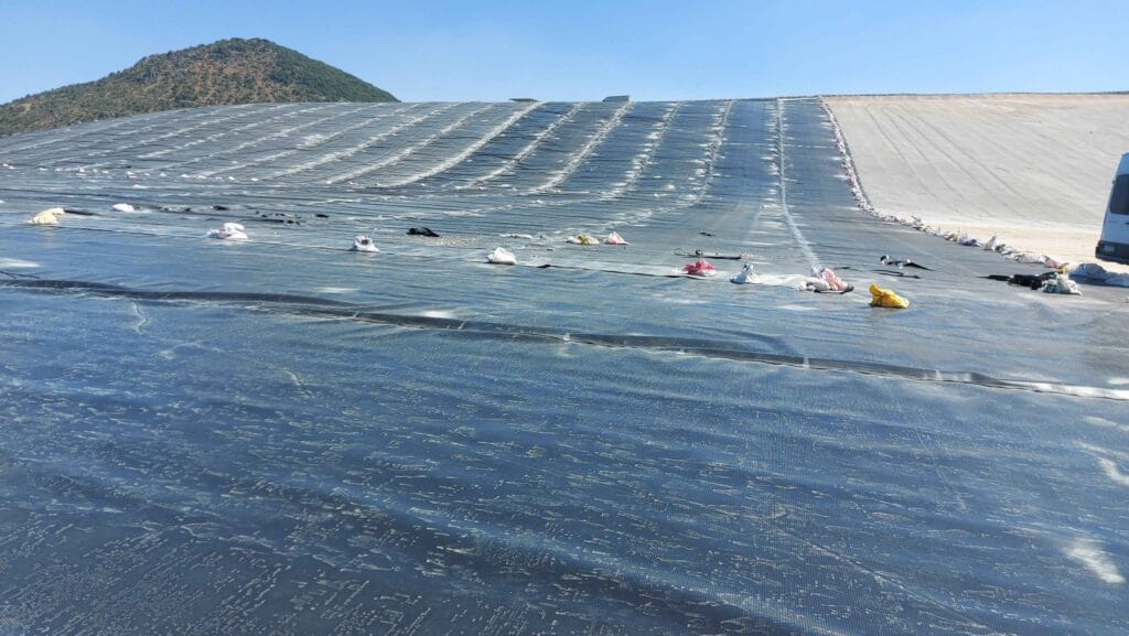 Geomembrane deployment and welding work on the slope of Kışladağ Gold Mine heap leach pad